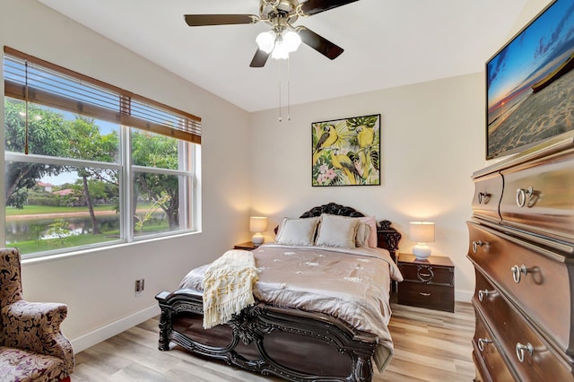 116 Ibisca Ter, Royal Palm Beach, FL 33411 - bedroom with baseboards, light wood-style flooring, and ceiling fan