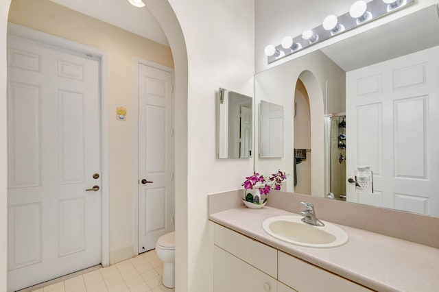 116 Ibisca Ter, Royal Palm Beach, FL 33411 - full bathroom featuring vanity, toilet, tile patterned flooring, and a shower