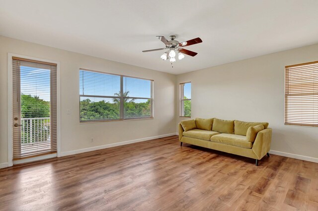 116 Ibisca Ter, Royal Palm Beach, FL 33411 - living area with a ceiling fan, baseboards, and light wood-type flooring
