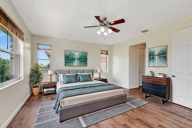 116 Ibisca Ter, Royal Palm Beach, FL 33411 - bedroom featuring baseboards, wood finished floors, and ceiling fan