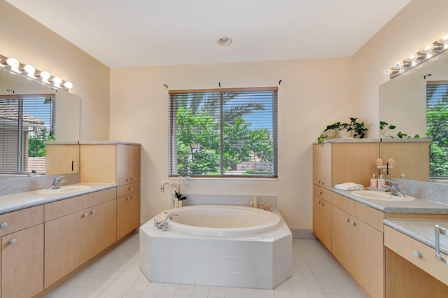 116 Ibisca Ter, Royal Palm Beach, FL 33411 - bathroom with tile patterned flooring, plenty of natural light, and two vanities