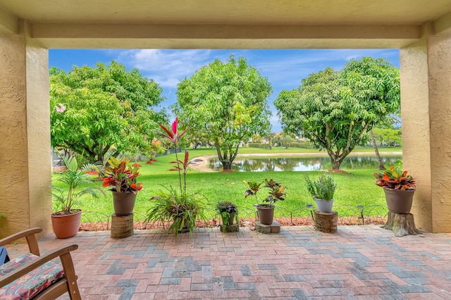 116 Ibisca Ter, Royal Palm Beach, FL 33411 - view of patio with a water view
