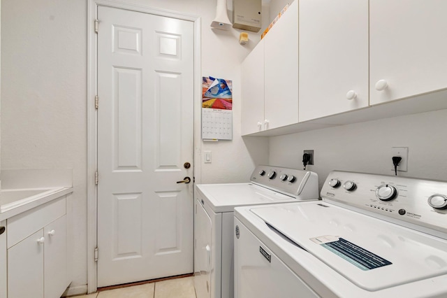 116 Ibisca Ter, Royal Palm Beach, FL 33411 - laundry area featuring cabinet space, washing machine and dryer, and light tile patterned flooring