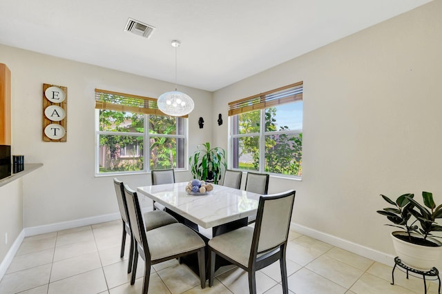 116 Ibisca Ter, Royal Palm Beach, FL 33411 - dining area featuring baseboards, a chandelier, and light tile patterned flooring