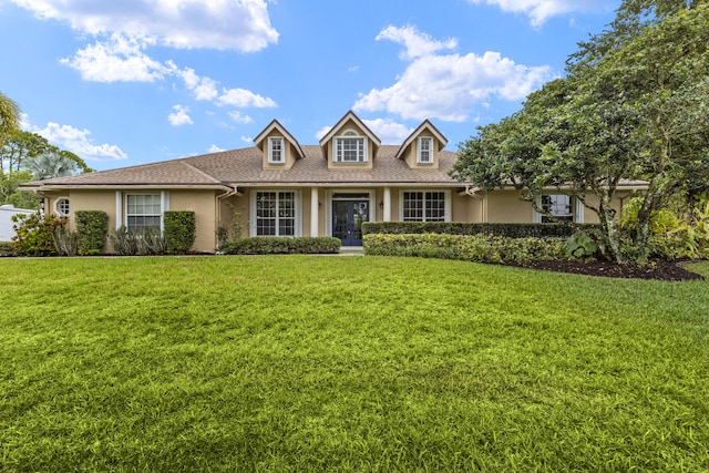 6342 120th Ave N, The Acreage, FL 33412 - view of front of property featuring stucco siding, a front yard, french doors, and roof with shingles