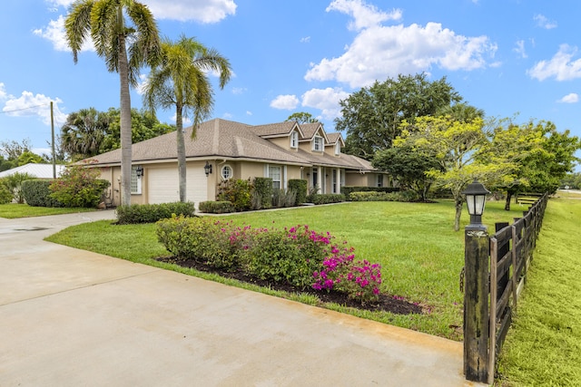 6342 120th Ave N, The Acreage, FL 33412 - view of front of house with concrete driveway, a garage, and stucco siding