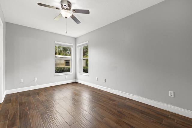 6342 120th Ave N, The Acreage, FL 33412 - empty room with a ceiling fan, baseboards, and dark wood-type flooring
