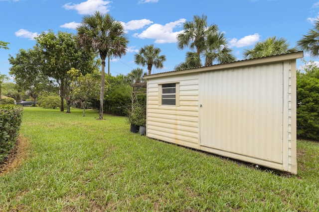 6342 120th Ave N, The Acreage, FL 33412 - view of green lawn featuring a storage unit and an outbuilding