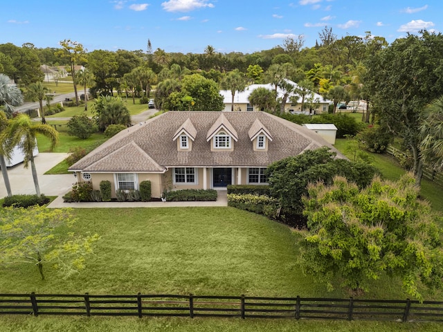 6342 120th Ave N, The Acreage, FL 33412 - cape cod-style house featuring stucco siding