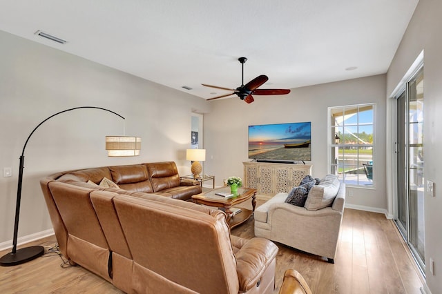 2211 Vero Beach Ln, West Palm Beach, FL 33411 - living room featuring light wood-style flooring, baseboards, and a ceiling fan