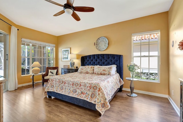 2211 Vero Beach Ln, West Palm Beach, FL 33411 - bedroom with wood finished floors, baseboards, and ceiling fan