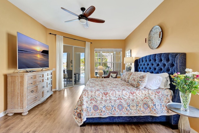 2211 Vero Beach Ln, West Palm Beach, FL 33411 - bedroom with access to exterior, wood finished floors, baseboards, and ceiling fan