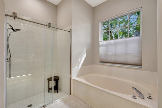 2211 Vero Beach Ln, West Palm Beach, FL 33411 - bathroom with a shower stall, a bath, and tile patterned floors
