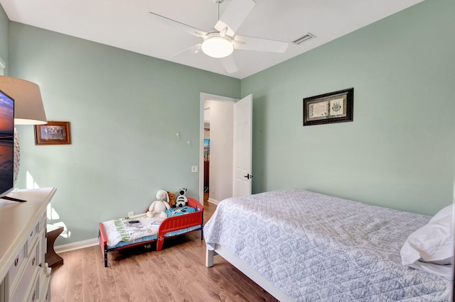 2211 Vero Beach Ln, West Palm Beach, FL 33411 - bedroom featuring light wood-style flooring, baseboards, and a ceiling fan