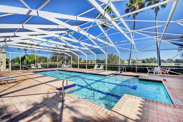 2211 Vero Beach Ln, West Palm Beach, FL 33411 - swimming pool with a patio area and glass enclosure