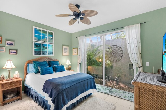 tiled bedroom with access to outside and ceiling fan