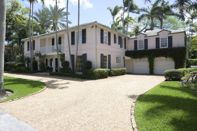 218 El Brillo Way, Palm Beach, FL 33480 - view of front of property with driveway, stucco siding, a garage, and a balcony