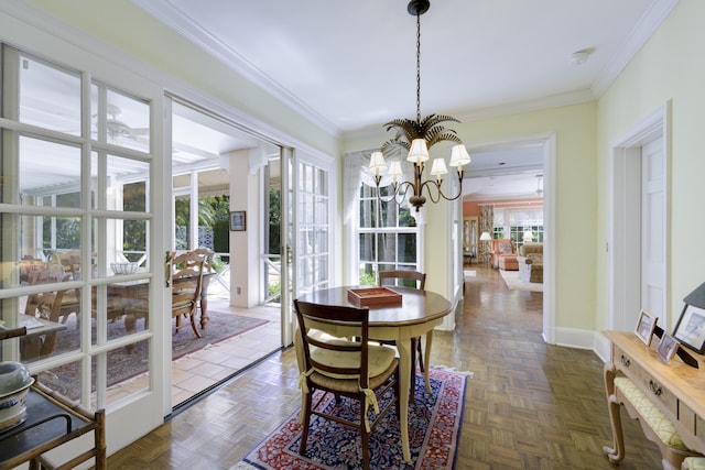 218 El Brillo Way, Palm Beach, FL 33480 - dining room with a chandelier, ornamental molding, and baseboards