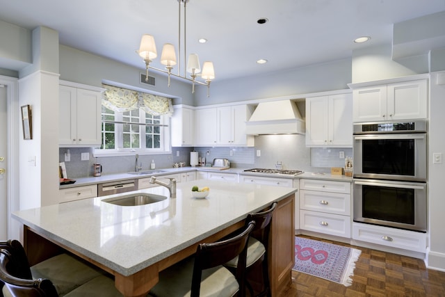 218 El Brillo Way, Palm Beach, FL 33480 - kitchen featuring appliances with stainless steel finishes, custom range hood, a sink, white cabinets, and recessed lighting