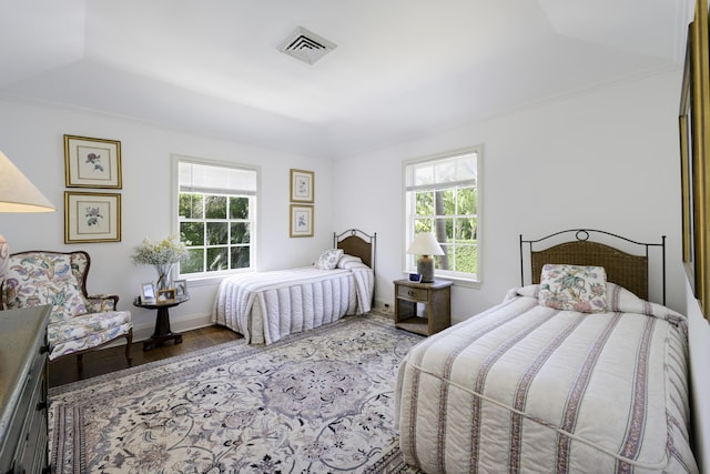 218 El Brillo Way, Palm Beach, FL 33480 - bedroom featuring multiple windows, wood finished floors, and ornamental molding