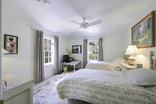 218 El Brillo Way, Palm Beach, FL 33480 - carpeted bedroom featuring multiple windows and a ceiling fan