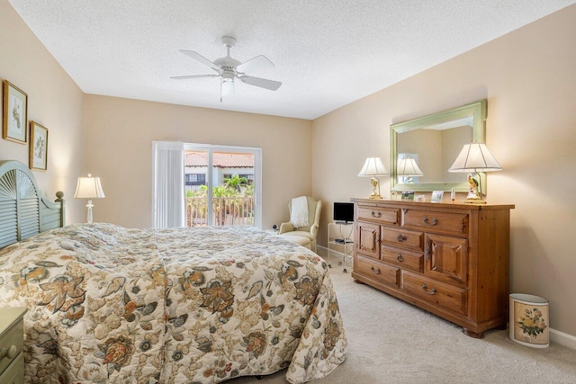 5900 Old Ocean Blvd Unit C6, Ocean Ridge, FL 33435 - bedroom featuring light carpet, ceiling fan, access to outside, a textured ceiling, and baseboards