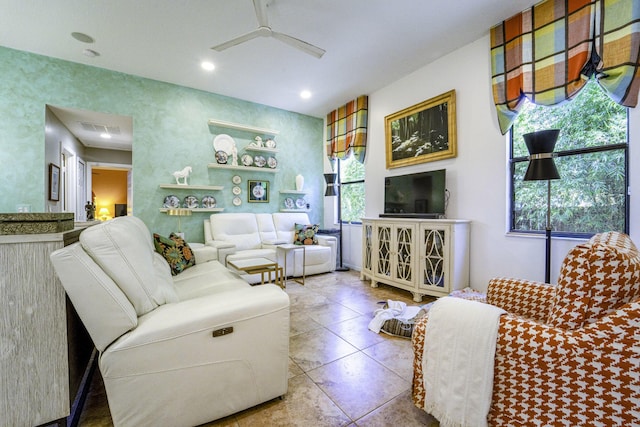 living room featuring plenty of natural light, ceiling fan, tile patterned floors, and recessed lighting