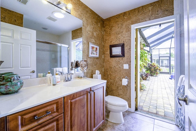 bathroom featuring plenty of natural light, a shower stall, toilet, and vanity