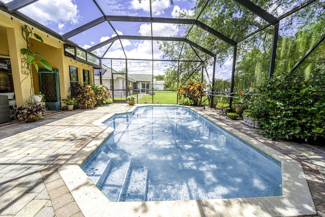 outdoor pool with a patio and a lanai
