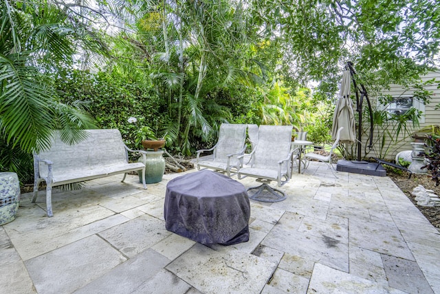 view of patio with a fire pit