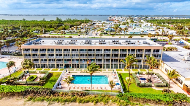 9800 S Ocean Dr Unit 415, Jensen Beach, FL 34957 - drone / aerial view of a pool area and a nearby body of water