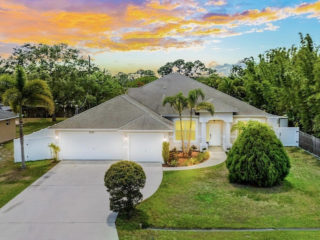 3552 SW Dellamano St, Port Saint Lucie, FL 34953 - ranch-style home with roof with shingles, driveway, a garage, and stucco siding