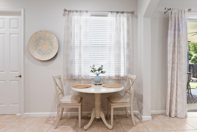 3552 SW Dellamano St, Port Saint Lucie, FL 34953 - tiled dining room with arched walkways and baseboards