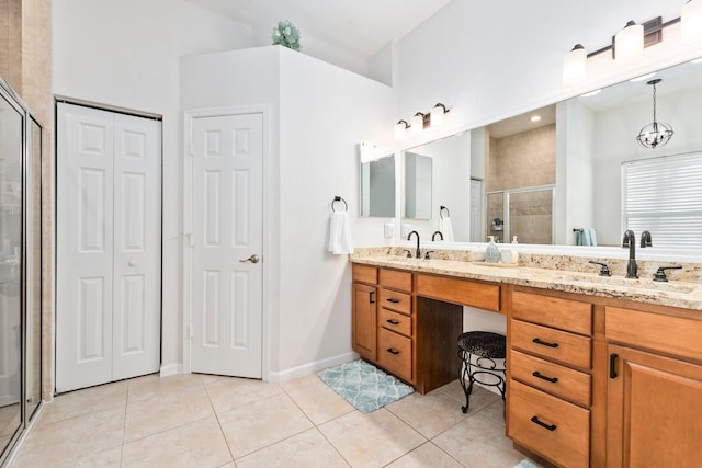 3552 SW Dellamano St, Port Saint Lucie, FL 34953 - bathroom featuring a stall shower, tile patterned flooring, a closet, and double vanity