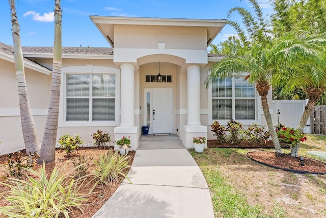 3552 SW Dellamano St, Port Saint Lucie, FL 34953 - entrance to property with fence and stucco siding