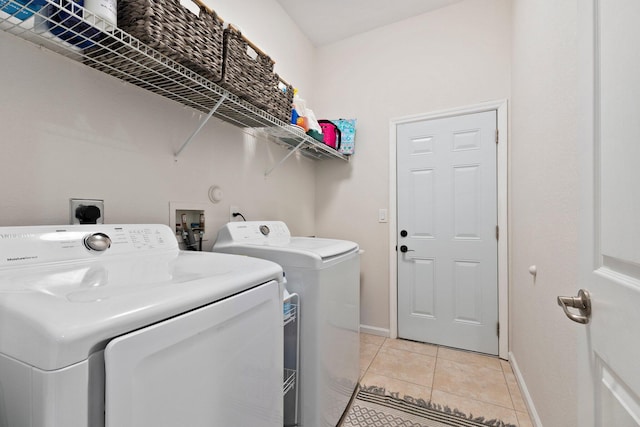 3552 SW Dellamano St, Port Saint Lucie, FL 34953 - laundry area with washer and clothes dryer, light tile patterned floors, and baseboards