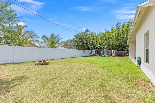 3552 SW Dellamano St, Port Saint Lucie, FL 34953 - view of yard with a fire pit and a playground