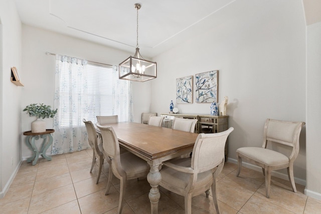 3552 SW Dellamano St, Port Saint Lucie, FL 34953 - dining area with a chandelier, baseboards, and light tile patterned floors
