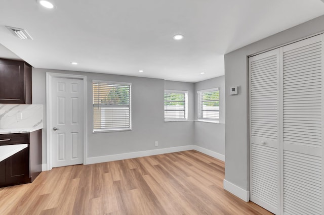 125 E Hart St, Lantana, FL 33462 - unfurnished dining area with light wood-type flooring, baseboards, and recessed lighting