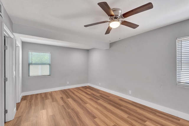 125 E Hart St, Lantana, FL 33462 - unfurnished bedroom with light wood-type flooring, baseboards, and ceiling fan