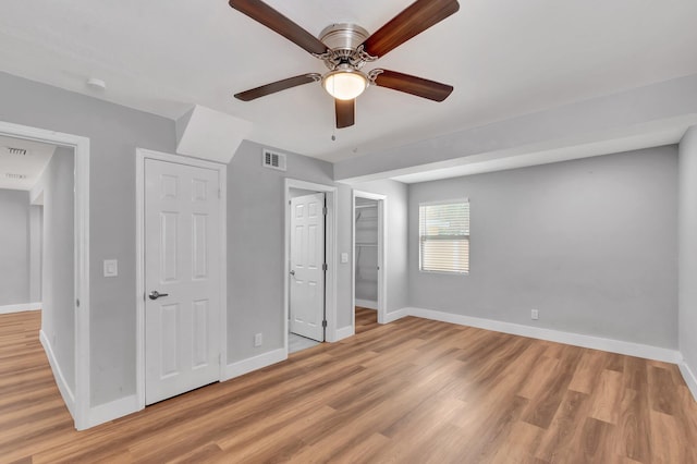 125 E Hart St, Lantana, FL 33462 - unfurnished bedroom with baseboards, light wood-style floors, and ceiling fan