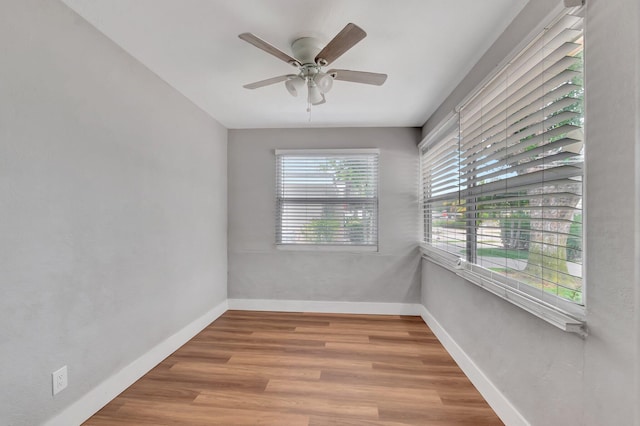 125 E Hart St, Lantana, FL 33462 - empty room featuring a ceiling fan, wood finished floors, and baseboards