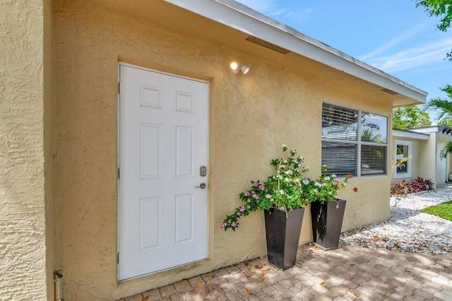 125 E Hart St, Lantana, FL 33462 - property entrance featuring stucco siding