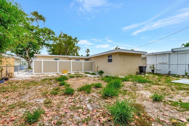 125 E Hart St, Lantana, FL 33462 - rear view of house with stucco siding
