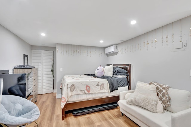 125 E Hart St, Lantana, FL 33462 - bedroom featuring a wall mounted air conditioner, light wood-style flooring, and recessed lighting