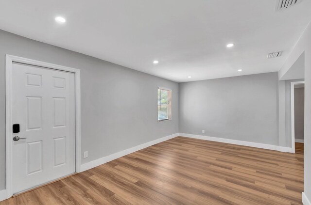 125 E Hart St, Lantana, FL 33462 - empty room with baseboards, wood finished floors, and recessed lighting