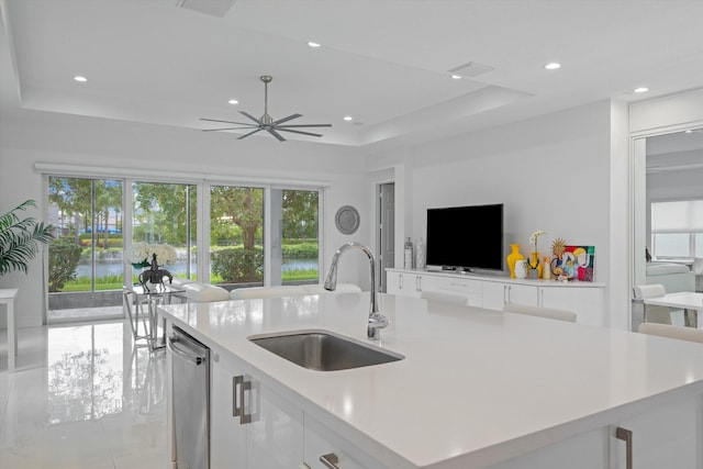 12582 Copper Mountain Pass, Boynton Beach, FL 33473 - kitchen featuring a sink, dishwasher, light countertops, a tray ceiling, and recessed lighting