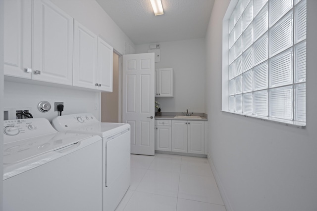 12582 Copper Mountain Pass, Boynton Beach, FL 33473 - laundry room with cabinet space, washing machine and dryer, light tile patterned floors, and baseboards