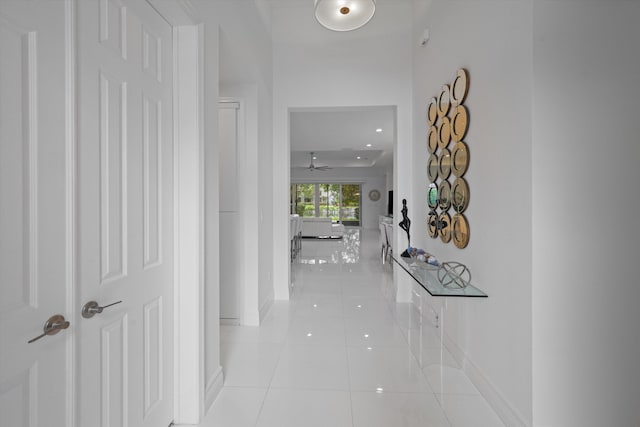 12582 Copper Mountain Pass, Boynton Beach, FL 33473 - hallway with light tile patterned flooring, baseboards, and recessed lighting