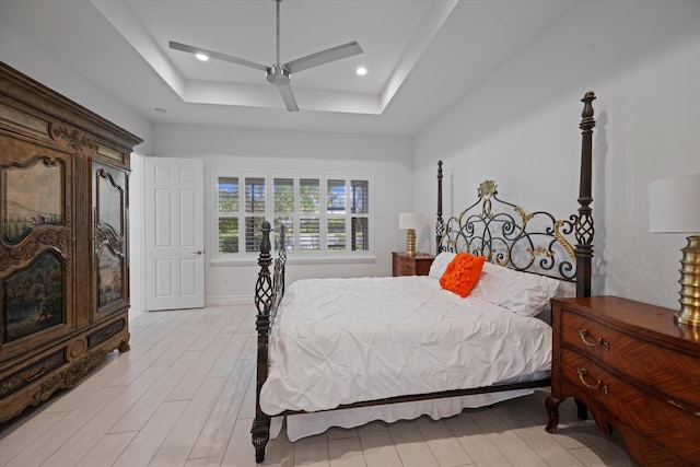 12582 Copper Mountain Pass, Boynton Beach, FL 33473 - bedroom with a raised ceiling, a ceiling fan, and light wood-style floors